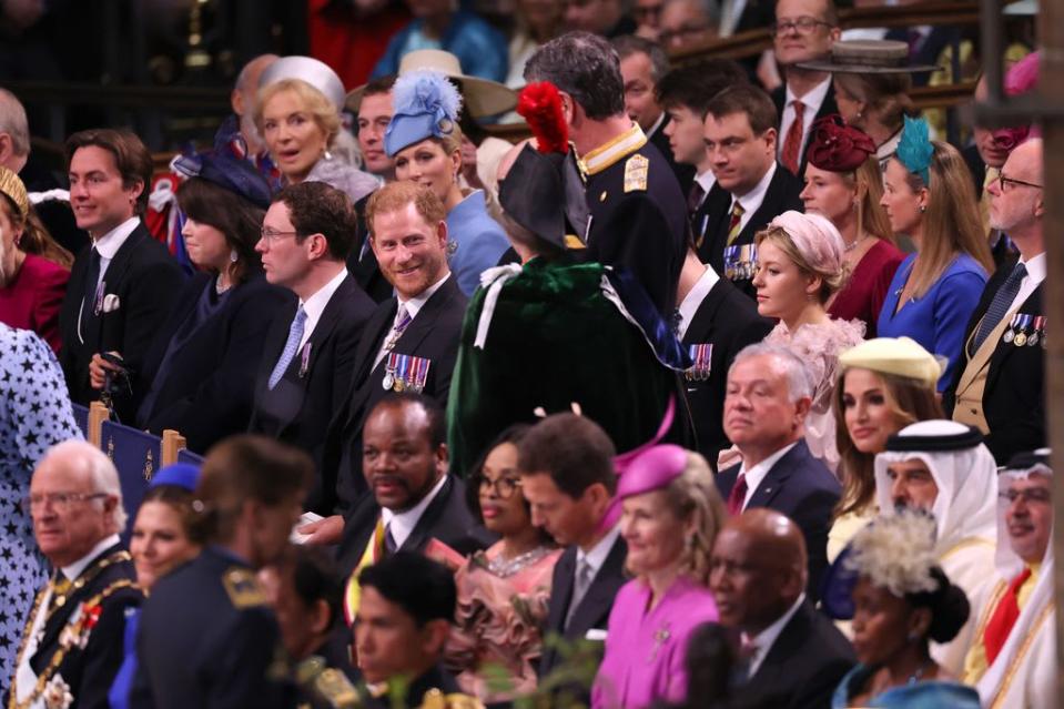 Prince Harry smiling at Princess Anne