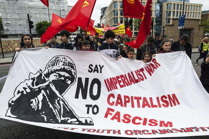 <p>People hold a banner during May Day celebrations at Clerkenwell Green in London, May 1, 2017. (David Nash/Barcroft Images/Barcroft Media via Getty Images) </p>