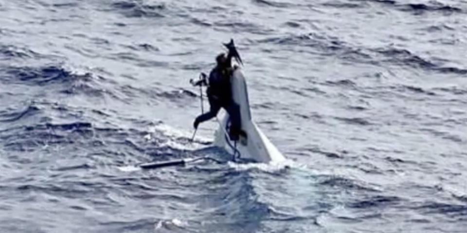 Florida truck driver Stuart Bee, 62, was found by a cargo ship clinging to his 32-foot boat nearly 90 miles from the Florida coast in an incredible rescue.  (USCG)