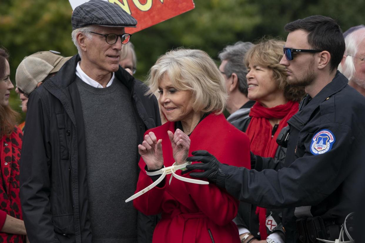 Jane Fonda, joined by Ted Danson, is arrested at the Capitol after she and other demonstrators called on Congress for action to address climate change, in Washington, DC on 25 October, 2019: AP Photo/J Scott ApplewhiteAP