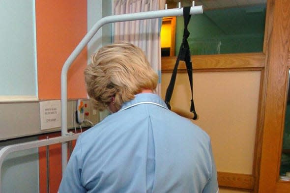 Undated file photo of a nurse treating a patient as nursing cutbacks are directly linked to higher patient death rates in hospitals, a major study has found. PRESS ASSOCIATION Photo. Issue date: Wednesday February 26, 2014. Every extra patient added to a nurse's workload increases the risk of death within a month of surgery by 7%, according to data from 300 European hospitals in nine countries. The situation is made worse by employing poorly qualified nurses, the research showed. When nurses had university degrees, this went a long way towards making up for reduced staffing levels. See PA story HEALTH Nurses. Photo credit should read: David Jones/PA Wire