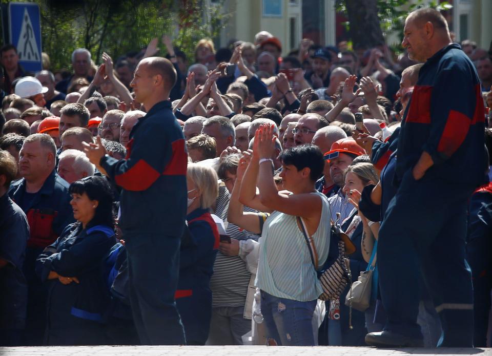 Employees of the state-run Minsk Automobile Plant (MAZ) are seen through an entrance checkpoint during a protest against presidential election results and to demand a new election, in Minsk, Belarus, August 14, 2020. / Credit: VASILY FEDOSENKO/REUTERS