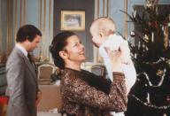 <p>Queen Silvia holds her son, Prince Carl Philip, in December 1979. The royals welcomed Carl Philip, their second child, in May 1979. </p>