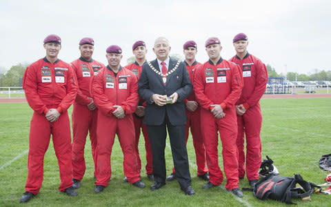 This year the rent was delivered by a Red Devils skydiver as part of an aerial display costing £2,122 - Credit: SWNS