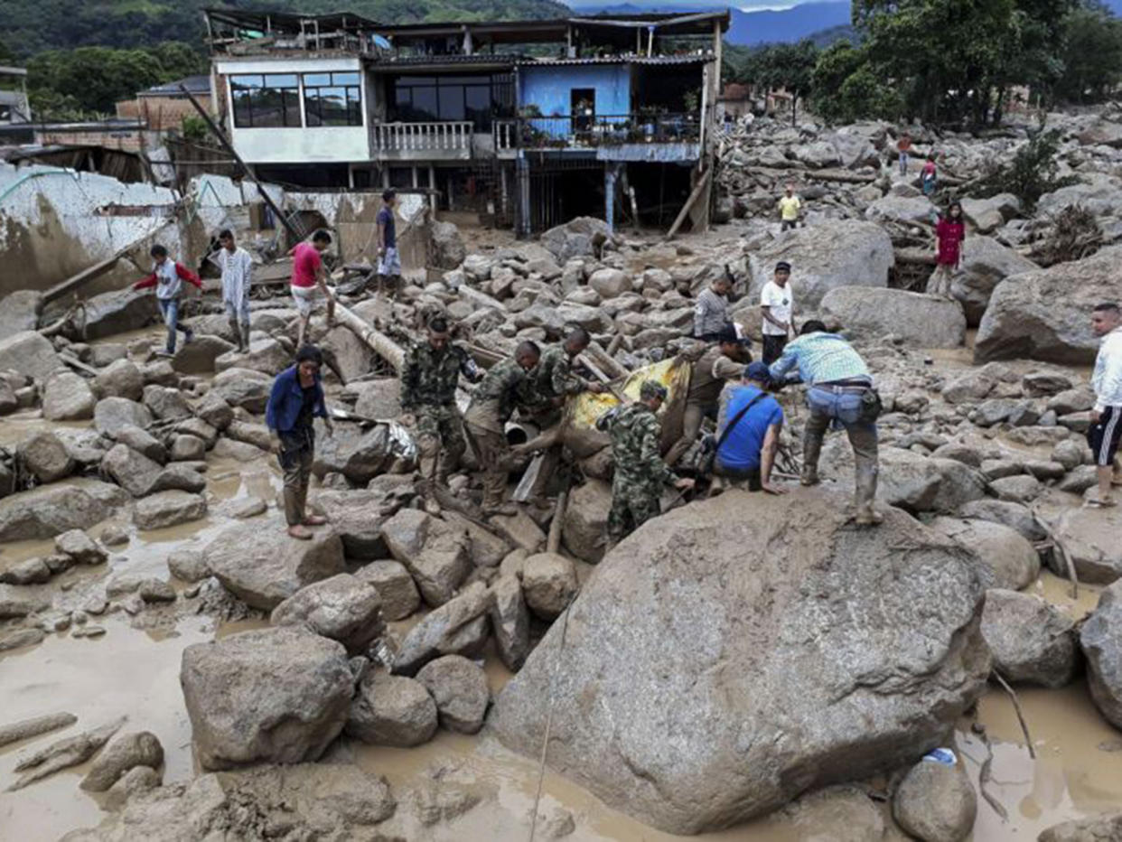 Heavy rains sent mud and debris crashing into houses overnight in the province of Putumayo: AFP/Getty