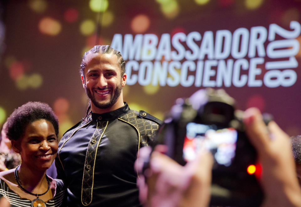 Former NFL quarterback Colin Kaepernick, posing at the Amnesty International Ambassador of Conscience Award in April, is facing a strong legal move from the NFL. (AP) 