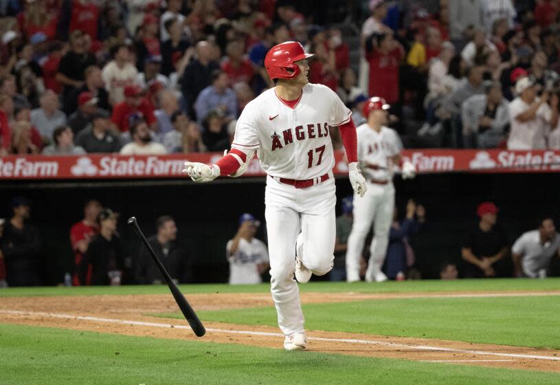 Angels designated hitter Shohei Ohtani (17) flips his bat after flying out against the Dodgers on June 20, 2023 in Anaheim.