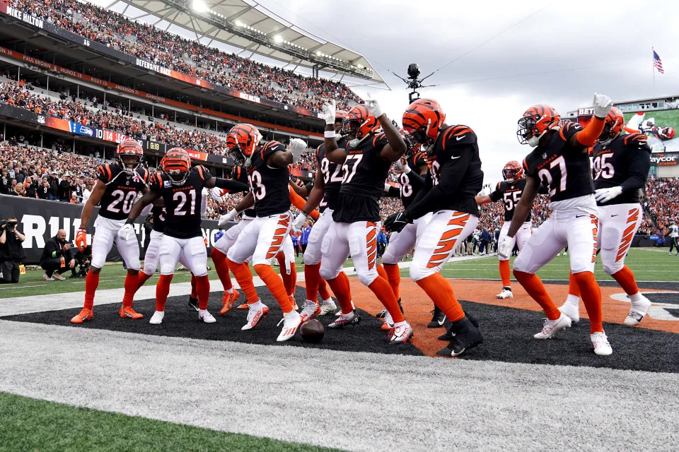 The Cincinnati Bengals defense celebrates with Cincinnati Bengals cornerback Mike Hilton (21) after his interception in the third quarter during an NFL football game between the Seattle Seahawks and the Cincinnati Bengals Sunday, Oct. 15, 2023, at Paycor Stadium in Cincinnati.