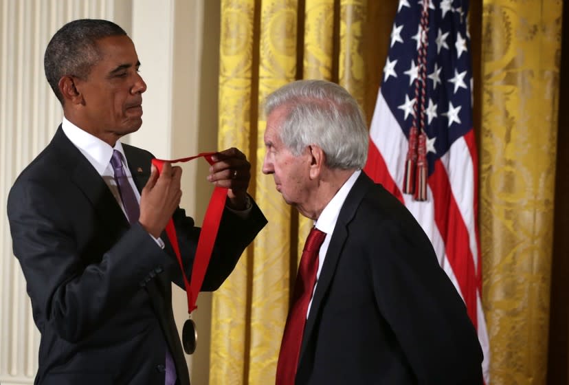 WASHINGTON, DC - SEPTEMBER 10: U.S. President Barack Obama (L) presents the 2014 National Humanities Medal to Larry McMurtry during an East Room ceremony at the White House September 10, 2015 in Washington, DC. Larry McMurtry was honored for his books, essays, and screenplays. (Photo by Alex Wong/Getty Images)