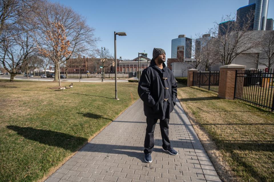 Local historian Jamon Jordan of Detroit stands near the intersection of St. Antoine and East Congress in downtown Detroit on March 19, 2021, where houses and other historic buildings once stood in the historic Black Bottom neighborhood. The intersection was also once home to the first Jewish Religious Services and the home of William Webb, where Frederick Douglass and John Brown met to discuss abolishing slavery, and Detroit's third Black church, St. Mathews Episcopal.