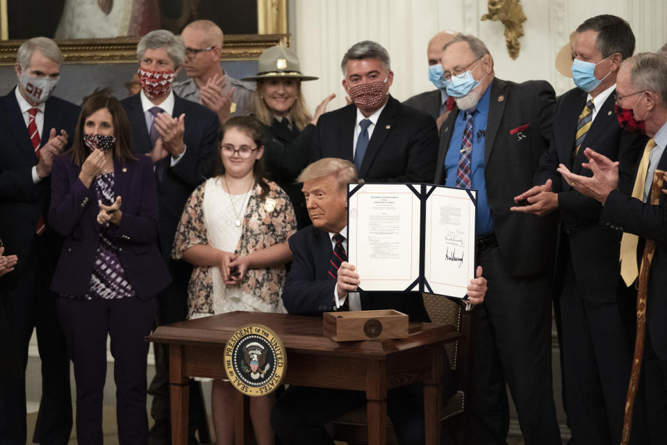 President Donald Trump signs the Great American Outdoors Act during a singing ceremony in the East Room of the White House on Aug. 4 in Washington, D.C. (Photo: Drew Angerer via Getty Images)