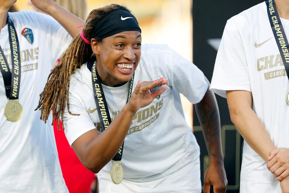 North Carolina Courage's Jessica McDonald waves to fans during the trophy presentation following an NWSL championship soccer game against the Chicago Red Stars in Cary, N.C., Sunday, Oct. 27, 2019. (AP Photo/Karl B DeBlaker)