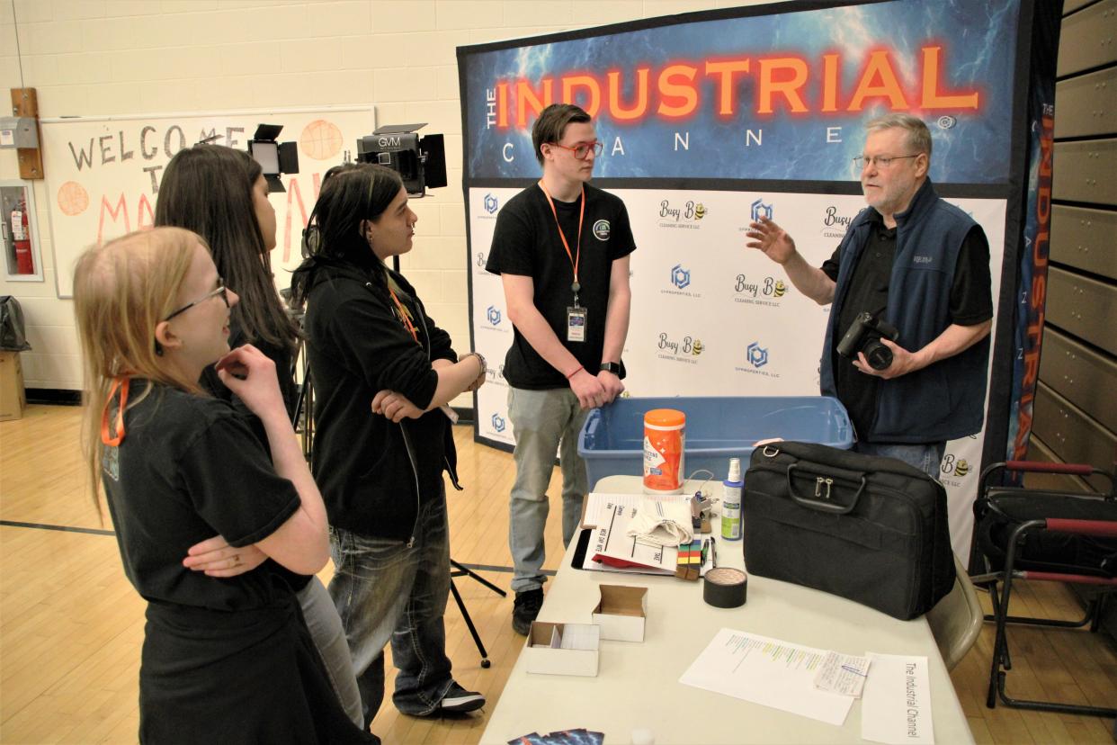 Students from the Tri-Rivers Career Center interactive media program spent time learning how to conduct and film interviews for The Industrial Channel with people attending the Marion Campus Job and Internship Fair on Wednesday, April 12, 2023, at The Ohio State University at Marion. Terry Cline, far right, owner of media production company Challenge Productions, briefs, from left, Cailea Williams, Kassidy DeSouza, Stefan Long, and James Bessler about their responsibilities for the day.