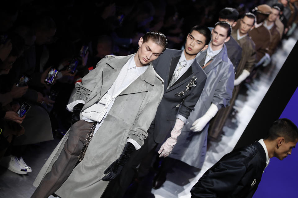 Models wear creations for the Dior Homme Mens Fall/Winter 2020-2021 fashion collection presented in Paris, Friday Jan. 17, 2020. (AP Photo/Francois Mori)