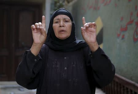 Fathia Hashem, mother of Amr Abushanab, who died in police custody, speaks with Reuters during an interview at their house in Tahanoub village, Egypt, November 30, 2015. DEATH REUTERS/Amr Abdallah Dalsh