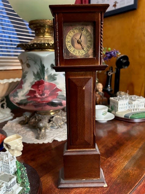 The writer's miniature grandfather's clock.