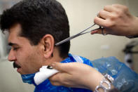 <b>Leech Therapy: Blood purgation</b><br> A nurse puts a leech under the ear of Iranian patient Manouchehr Najafi as he receives Leech Therapy at a traditional medical clinic in Tehran on February 25, 2012. <b> AFP PHOTO/BEHROUZ MEHRI</b>