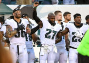 FILE PHOTO: Philadelphia Eagles strong safety Malcolm Jenkins is joined by defensive end Chris Long and free safety Rodney McLeod during the national anthem against the Miami Dolphins in Philadelphia, August 24, 2017. Mandatory Credit: Eric Hartline-USA TODAY Sports