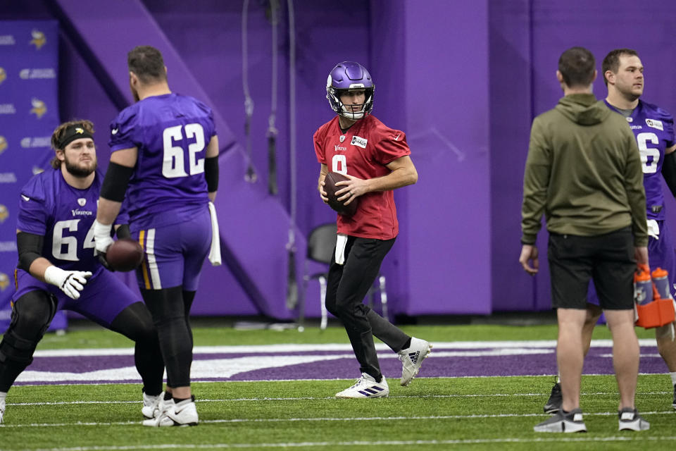 Minnesota Vikings quarterback Kirk Cousins (8), middle, takes part in drills during an NFL football team practice in Eagan, Minn., Wednesday, Jan. 11, 2023. The Vikings will play the New York Giants in a wild-card game on Sunday. (AP Photo/Abbie Parr)