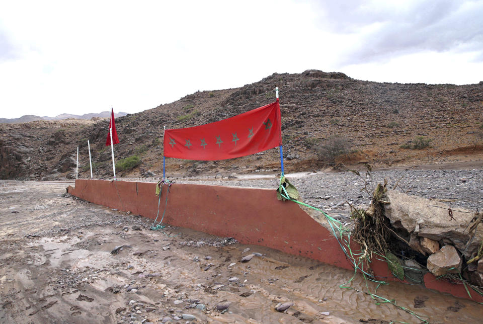 The wreckage of a football field is seen after a flash flood that swept across fans attending a a match, in Tizert, near the southern region of Taroudant, Morocco, Thursday, Aug. 29, 2019. Morocco's official MAP news agency says that seven people watching a local soccer match in a southern village have died in a flash flood that swept across a football field on Wednesday evening. (AP Photo/Mohamed Amerkad)