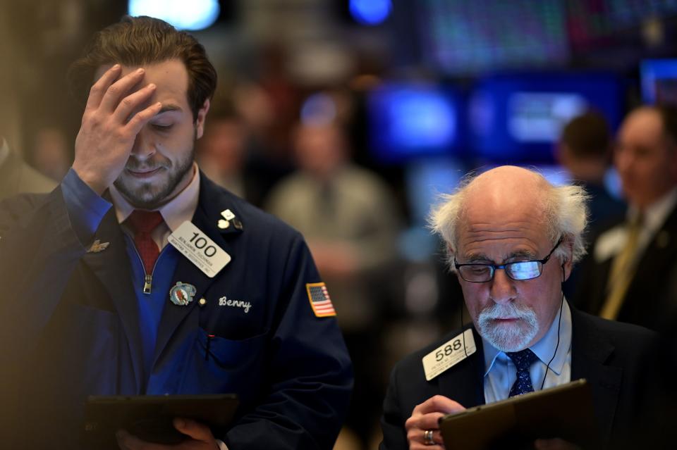 Traders work during the closing bell at the New York Stock Exchange (NYSE) on February 24, 2020 at Wall Street in New York City. - Wall Street stocks finished with steep losses February 24, 2020, joining a global rout on mounting worries that the coronavirus will derail economic growth. At the closing bell, the benchmark Dow Jones Industrial Average was down 3.6 percent at 27,962.91, a drop of more than 1,000 points and the biggest loss in a session in more than two years. (Photo by Johannes EISELE / AFP) (Photo by JOHANNES EISELE/AFP via Getty Images)