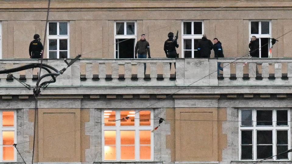 PHOTO: Armed police are seen on the balcony of the university in central Prague, Dec. 21, 2023. (Michal Cizek/AFP via Getty Images)