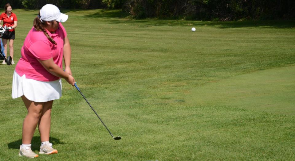 Airport's Sophie Bucki chips onto the green during the Monroe County Girls Gol Championships Thursday.