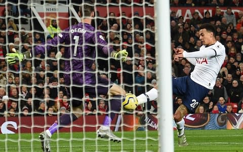 Dele Alli (R) shoots past Manchester United's Spanish goalkeeper David de Gea - Credit: AFP via Getty Images