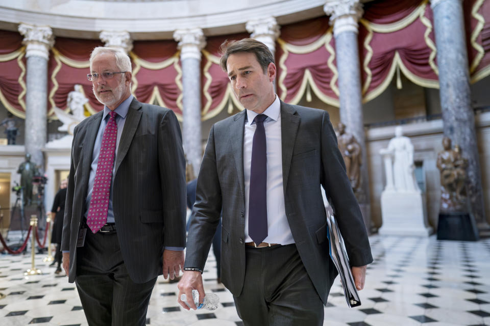 FILE - Rep. Garret Graves, R-La., right, a key point man on the debt ceiling bill for Speaker McCarthy, walks through Statuary Hall with Dan Meyer, McCarthy's chief of staff, left, at the Capitol in Washington, Wednesday, April 26, 2023. Graves has been named to represent Republicans in negotiations with the White House on the debt limit. (AP Photo/J. Scott Applewhite, File)