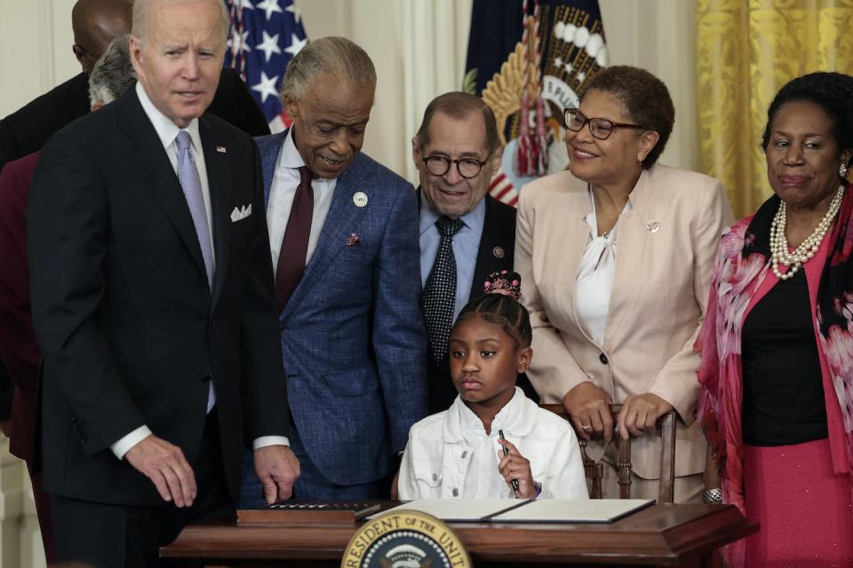 Gianna Floyd, the daughter of George Floyd, holds a pen used by U.S. President Joe Biden at the White House on May 25, 2022, to sign an executive order enacting further police reform. <a href="https://www.gettyimages.com/detail/news-photo/gianna-floyd-the-daughter-of-george-floyd-holds-a-pen-used-news-photo/1399292579?adppopup=true" rel="nofollow noopener" target="_blank" data-ylk="slk:Anna Moneymaker/Getty Images;elm:context_link;itc:0;sec:content-canvas" class="link ">Anna Moneymaker/Getty Images</a>