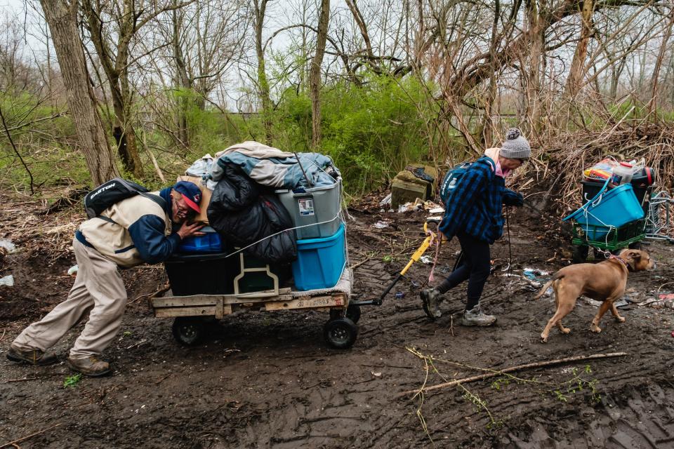 With the assistance of New Philadelphia Police officers, two people experiencing homelessness, Tonya and Troy, vacated a private property that had been used as a homeless encampment on Friday in New Philadelphia. Prior notice of the eviction was given to people at the encampment three months ago. Tonya all the while has maintained that the property is hers.