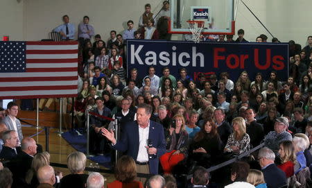 John Kasich addresses supporters during a campaign stop in the gymnasium of University Liggett School in Grosse Pointe Woods, Michigan, March 7, 2016. REUTERS/Rebecca Cook