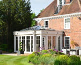 <p> One of the most common reasons to build a conservatory is to boost the amount of light that enters a home, and exactly how much extra light you want will depend on the intended use of the space.  </p> <p> ‘Orangeries with roof lights are ideal for kitchens as they provide a controlled amount of light through the roof and an opportunity to focus this above a kitchen island or dining table; whereas a conservatory, with its typically fully glazed roof will be the ideal design for plants to thrive,’ notes Karen Bell, Sales Director at David Salisbury. </p>