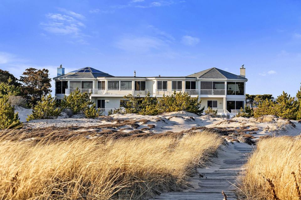 <p>For a cool £25 million, this ocean-facing home provides you with a slice of paradise. Inside, you'll find five bedrooms, 6.5 <a href="https://www.housebeautiful.com/uk/decorate/bathroom/a33023307/bathroom-devalue-property/" rel="nofollow noopener" target="_blank" data-ylk="slk:bathrooms;elm:context_link;itc:0;sec:content-canvas" class="link ">bathrooms</a>, a pool, tennis court and private boardwalk to the sandy beach. We couldn't think of anything better...</p><p><a href="https://timdavishamptons.com/1750-meadow-lane/" rel="nofollow noopener" target="_blank" data-ylk="slk:This property is currently on the market via Corcoran for £25.7 million;elm:context_link;itc:0;sec:content-canvas" class="link ">This property is currently on the market via Corcoran for £25.7 million</a>. </p>