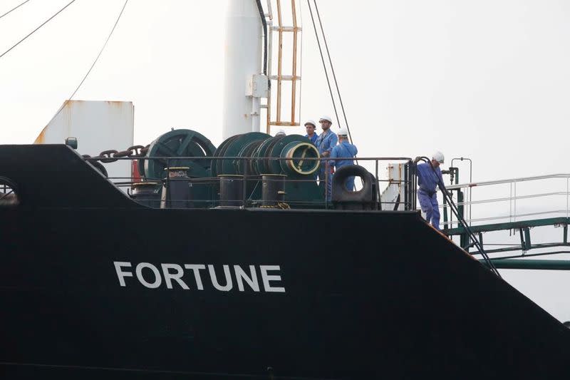 Crew of the Iranian tanker ship "Fortune" are seen at the deck during the arrival at El Palito refinery in Puerto Cabello