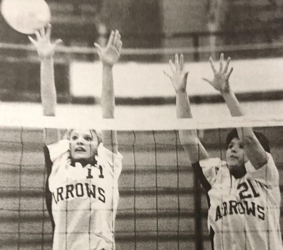 Watertown's Alanna Hetland (left) and Renae Heiden leap to block the ball during a 1997 high school volleyball match in the Watertown Civic Arena.