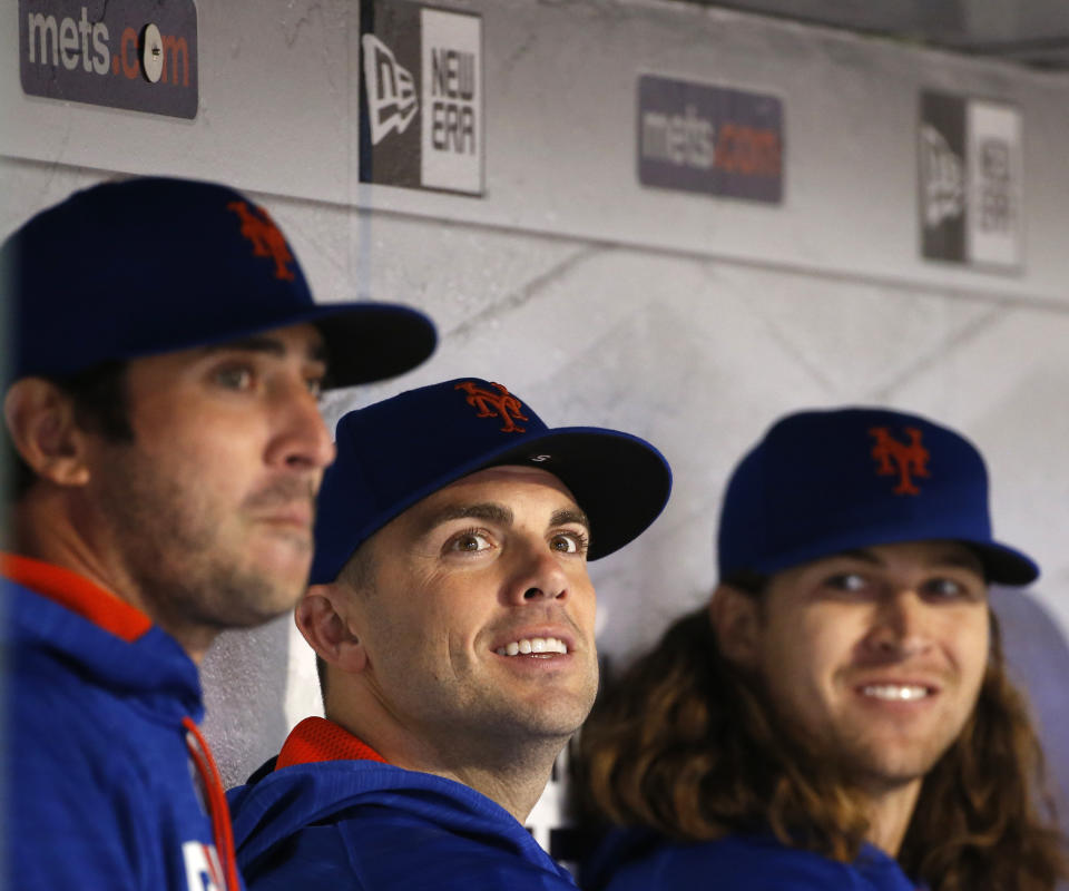 Matt Harvey, left, and David Wright, center, on the Mets bench. (AP)