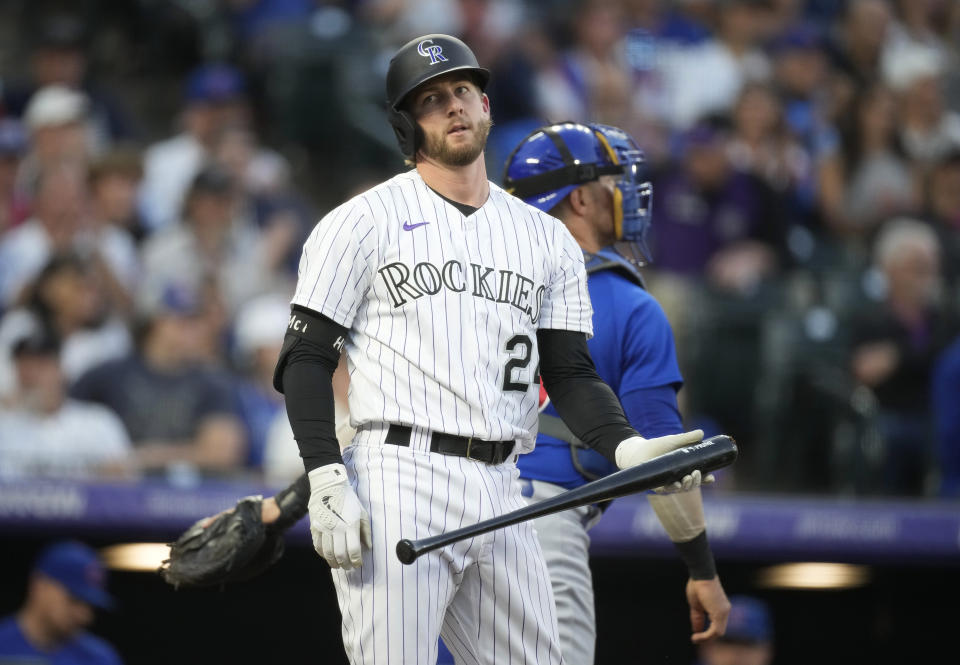 Colorado Rockies' Ryan McMahon reacts after striking out against Chicago Cubs starting pitcher Javier Assad to end the first inning of a baseball game Tuesday, Sept. 12, 2023, in Denver. (AP Photo/David Zalubowski)