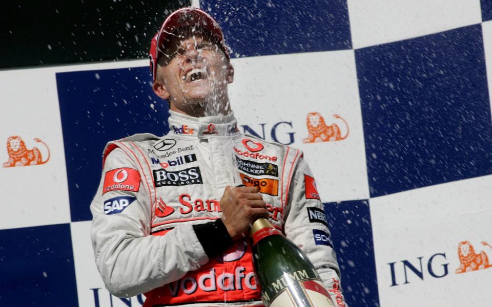 Heikki Kovalainen...epa01430066 Finnish Formula One driver Heikki Kovalainen of McLaren Mercedes celebrates with champagne on the podium after his victory of the Grand Prix of Hungary at the Hungaroring race track near Budapest, Hungary, 03 August 200 - EPA