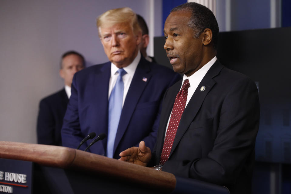 President Donald Trump listens as Housing and Urban Development Secretary Ben Carson speaks during a coronavirus task force briefing at the White House, Saturday, March 21, 2020, in Washington. (AP Photo/Patrick Semansky)