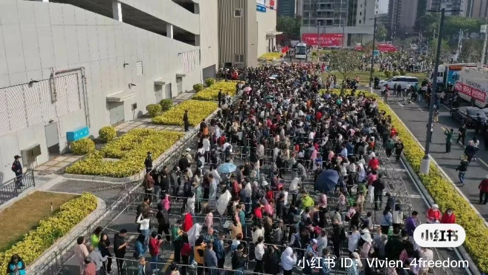 People line up outside the Costco store in Shenzhen, China, during its launch on January 12, 2024. - Vivien_4freedom/Xiaohongshu