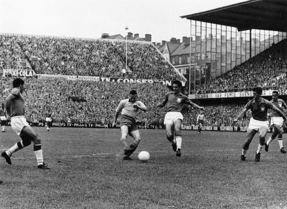 1958:  Nisse Niedholm (dark shorts) in action for Sweden against Brazil in the World Cup final in Stockholm. Brazil went on to win the match and become World Champions with a 5-2 victory.  (Photo by Keystone/Getty Images)