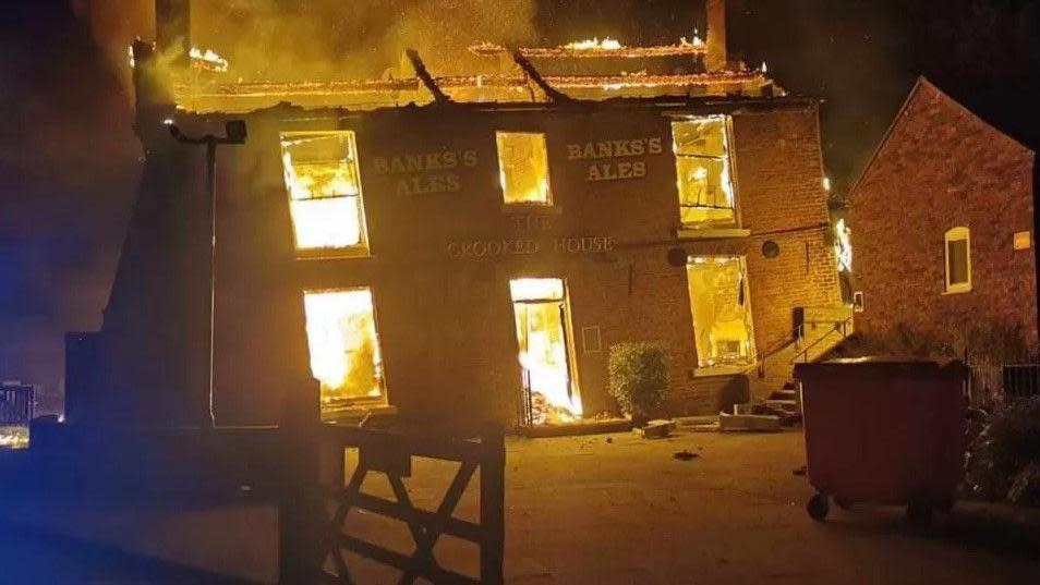The pub in flames