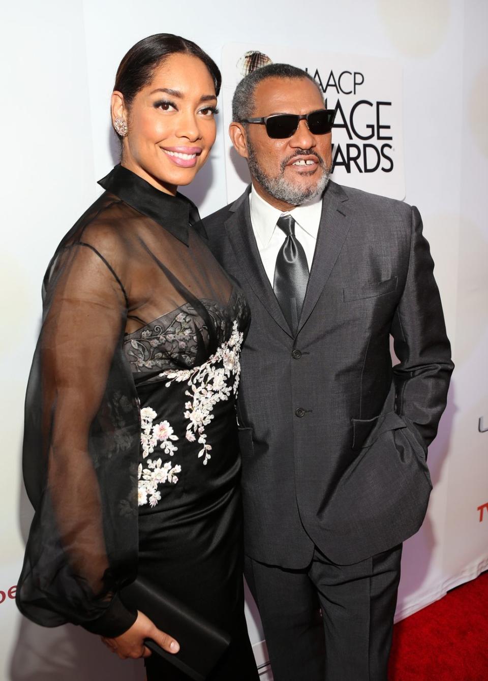 Gina Torres and Laurence Fishburne