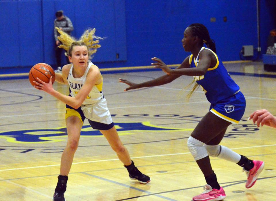 Clear Spring's Callie Alkire looks to make a play while being guarded by Broadfording's Fanta Minteh, who led the Lions to a 42-36 victory with 26 points, 13 rebounds, six blocks, four steals and three assists. Alkire led the Blazers with 12 points and eight rebounds.