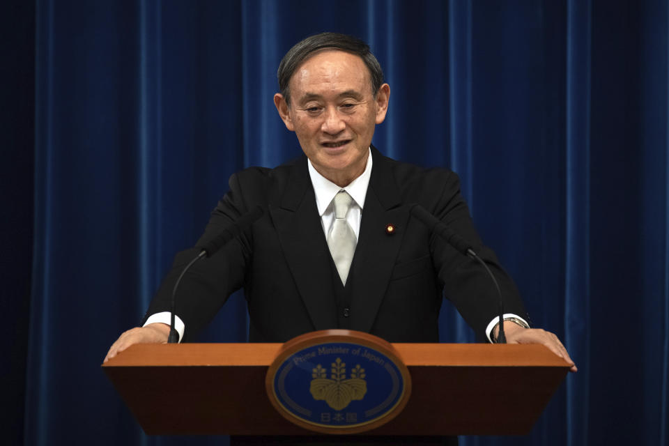 Japan's new Prime Minister Yoshihide Suga speaks during a press conference at the prime minister's official residence Wednesday, Sept. 16, 2020 in Tokyo, Japan. Suga, who was elected on Wednesday after gaining support for his pledges to pursue his predecessor Shinzo Abe's policies formed his 20-member Cabinet that retains many familiar faces, signaling continuation of Abe's line. (Carl Court/Pool Photo via AP)