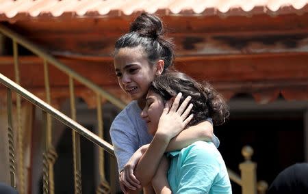 Relatives of Palestinian youth Laith al-Khaldi mourn during his funeral near the West Bank city of Ramallah August 1, 2015. REUTERS/Mohamad Torokman