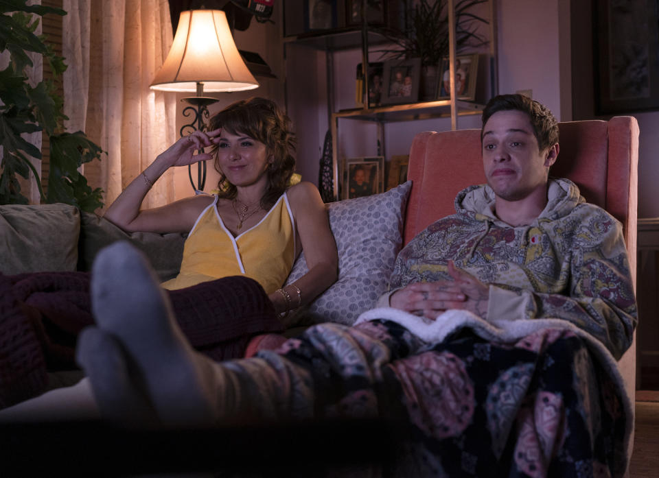 In this image released by Universal Pictures, Marisa Tomei, left, and Pete Davidson appear in a scene from "The King of Staten Island," directed by Judd Apatow. (Mary Cybulski/Universal Pictures via AP)