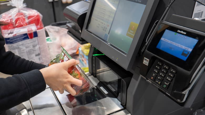 Costco shopper at self scanner