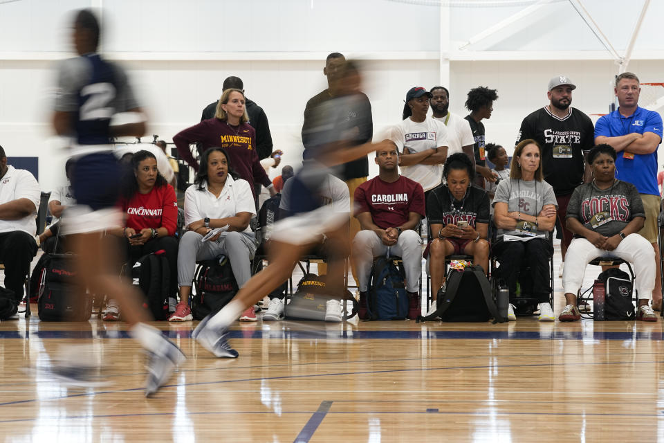 NCAA Division I and II women's basketball coaches watch players of the 2023 U.S.A. 3x3 Basketball U17 National Team practice at the NCAA College Basketball Academy, Friday, July 28, 2023, in Memphis, Tenn. (AP Photo/George Walker IV)
